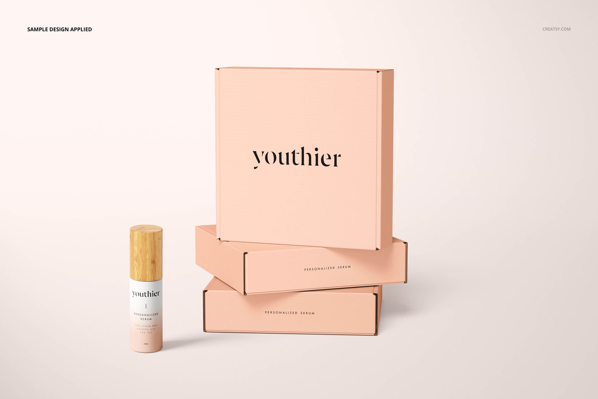 Front and side view of peach mailing boxes and a 30 ml bottle, arranged on a neutral surface for PSD mockup use.