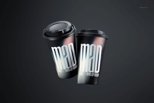 PSD mockup of two paper cups with black lids, metallic gradient surface, and prominent white typography on each.