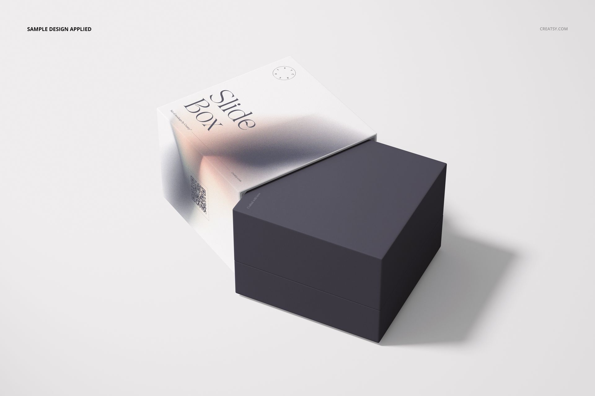 Rectangular slide gift box mockup with a dark lid and partially open white base, viewed from a top angle on a light surface.