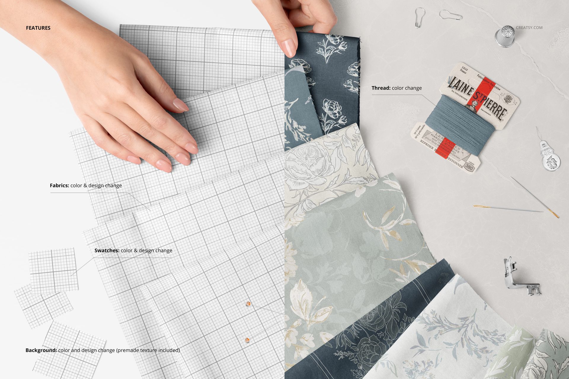 PSD mockup showing multiple patterned cotton fabric swatches, sewing tools, and a hand adjusting the materials on a white surface.