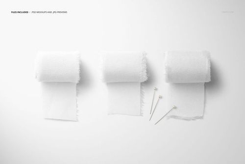 Minimalist scene showing three white silk ribbon rolls and three silver pins on a clean, light background for a mockup.