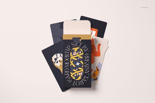 Tarot cards mockup set displayed with illustrated cards partially fanned out and box on a light surface.