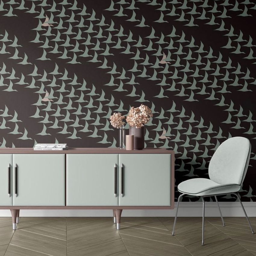 Canvas print mockup showing a modern sideboard and chair in front of a wall with a duck pattern design and neutral tones.