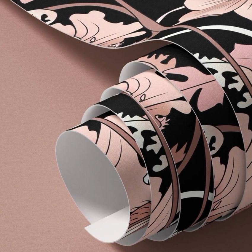 Paper wallpaper mockup featuring curled sheets with a bold floral pattern in black, blush pink, and beige on a soft pink background.