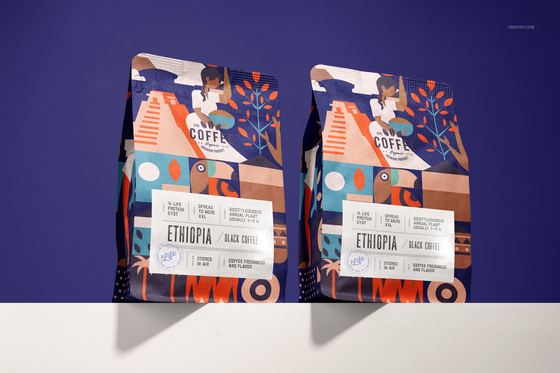 Two upright coffee bag mockups featuring geometric and illustrated designs, placed on a white surface with a purple backdrop.