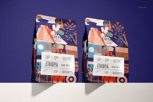Two upright coffee bag mockups featuring geometric and illustrated designs, placed on a white surface with a purple backdrop.