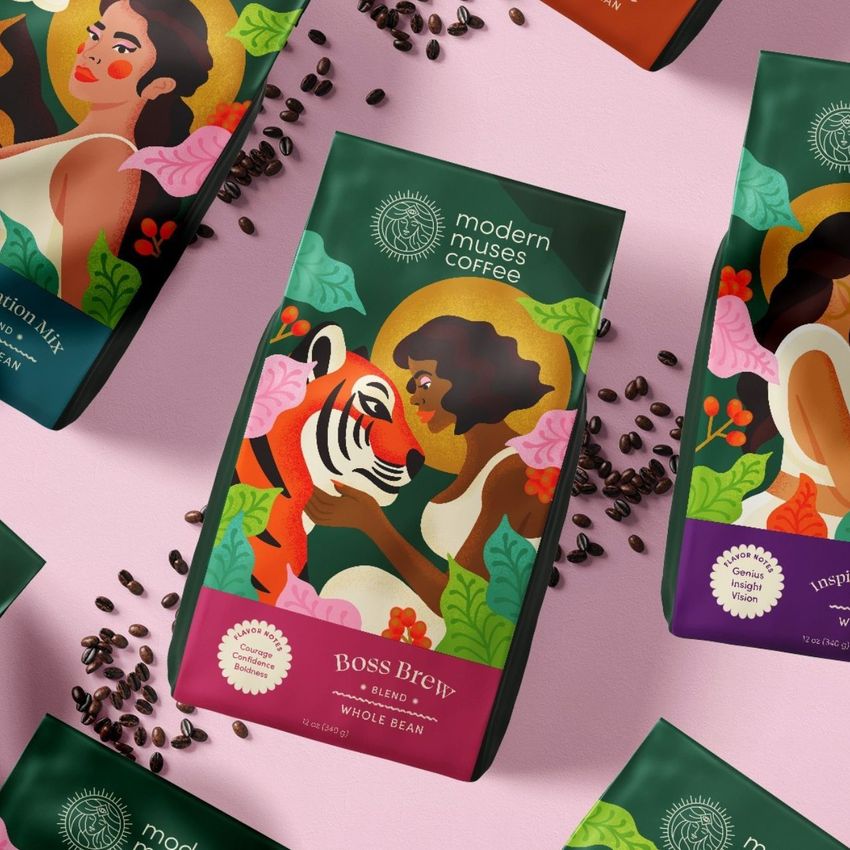 Paper coffee bag mockup featuring a colorful illustrated woman and tiger design, surrounded by scattered coffee beans on a pink surface.