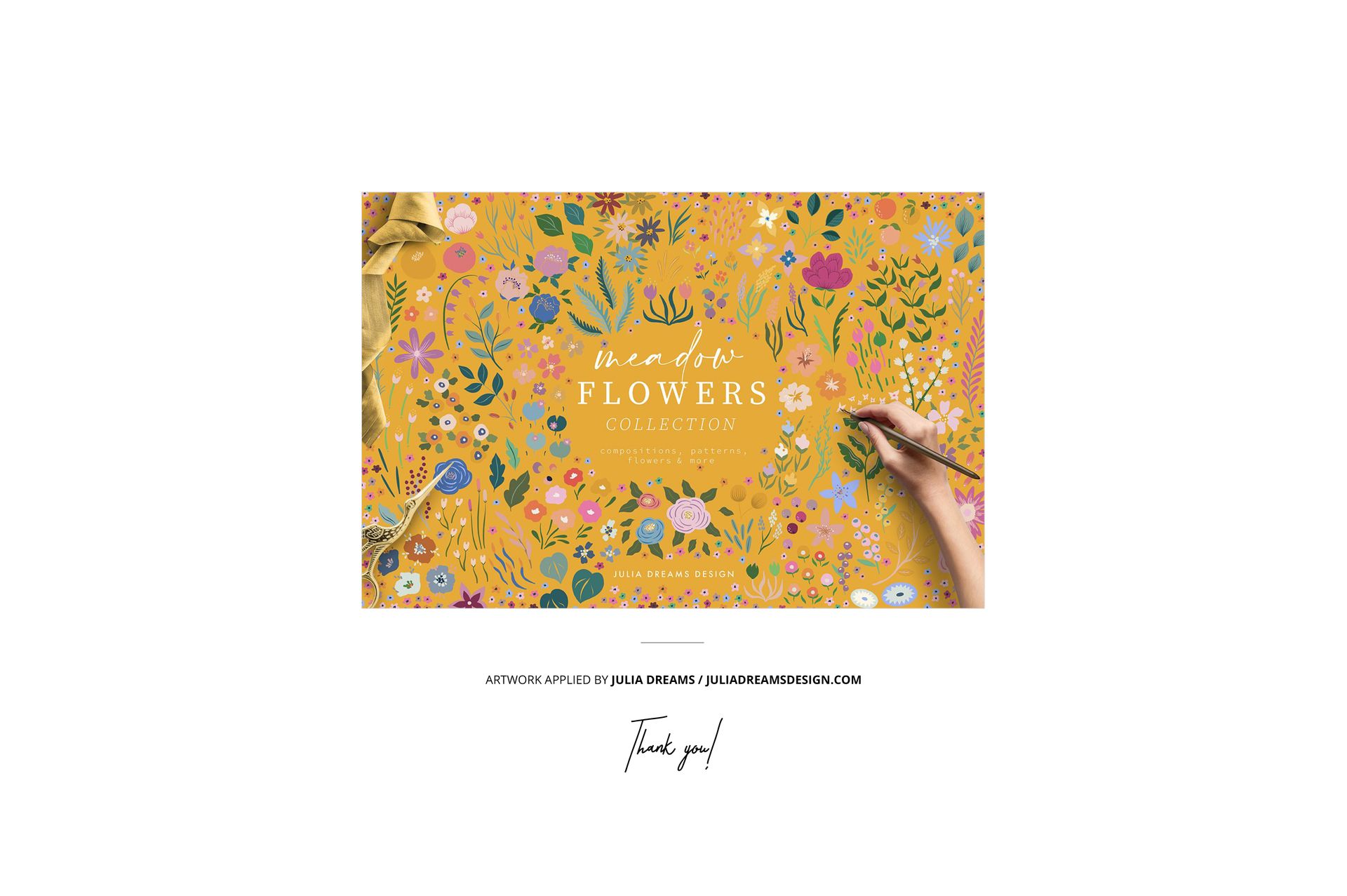 Folded fabric mockup featuring a yellow textile with colorful floral patterns, shown from a front view with a hand painting details.