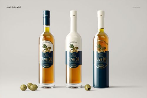 Front view of three olive oil bottles in a PSD mockup, featuring varied label styles and colors, with olives as props.