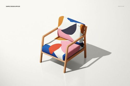 Front view of a lounge chair mockup with colorful geometric pattern on seat and back cushions, set against a white background.