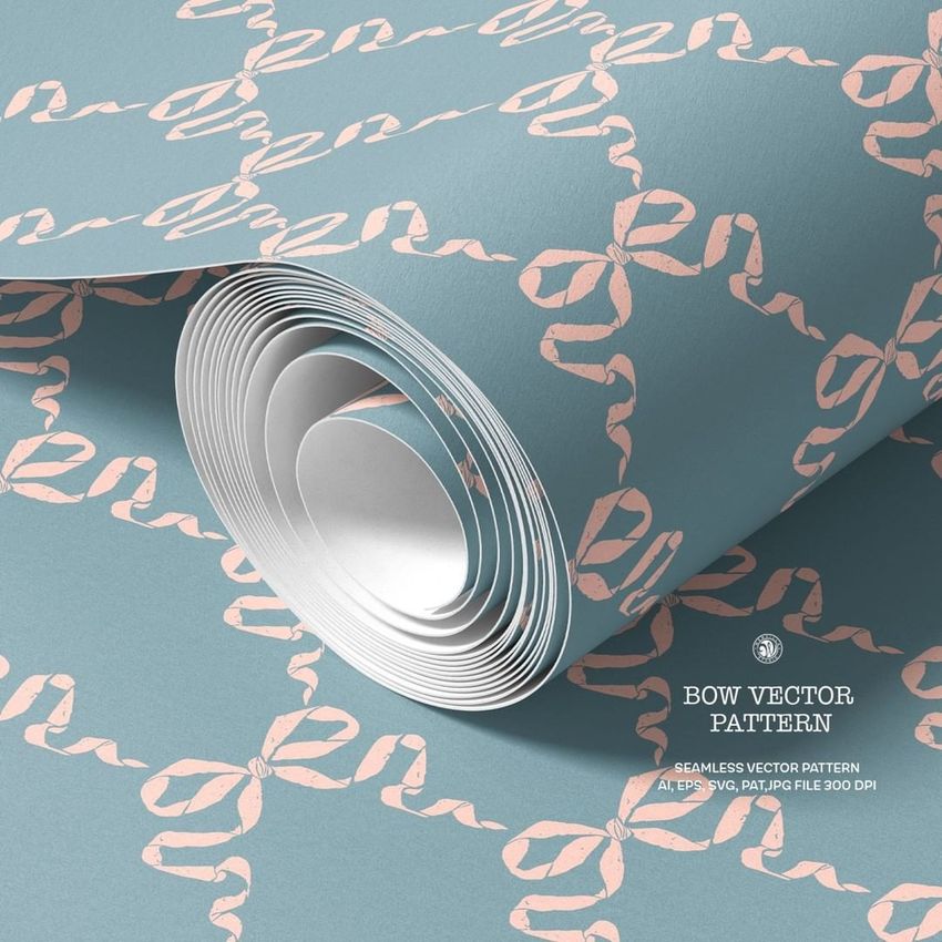 Paper wallpaper mockup featuring a close-up of rolled wallpaper with a pink bow pattern on a muted blue background.