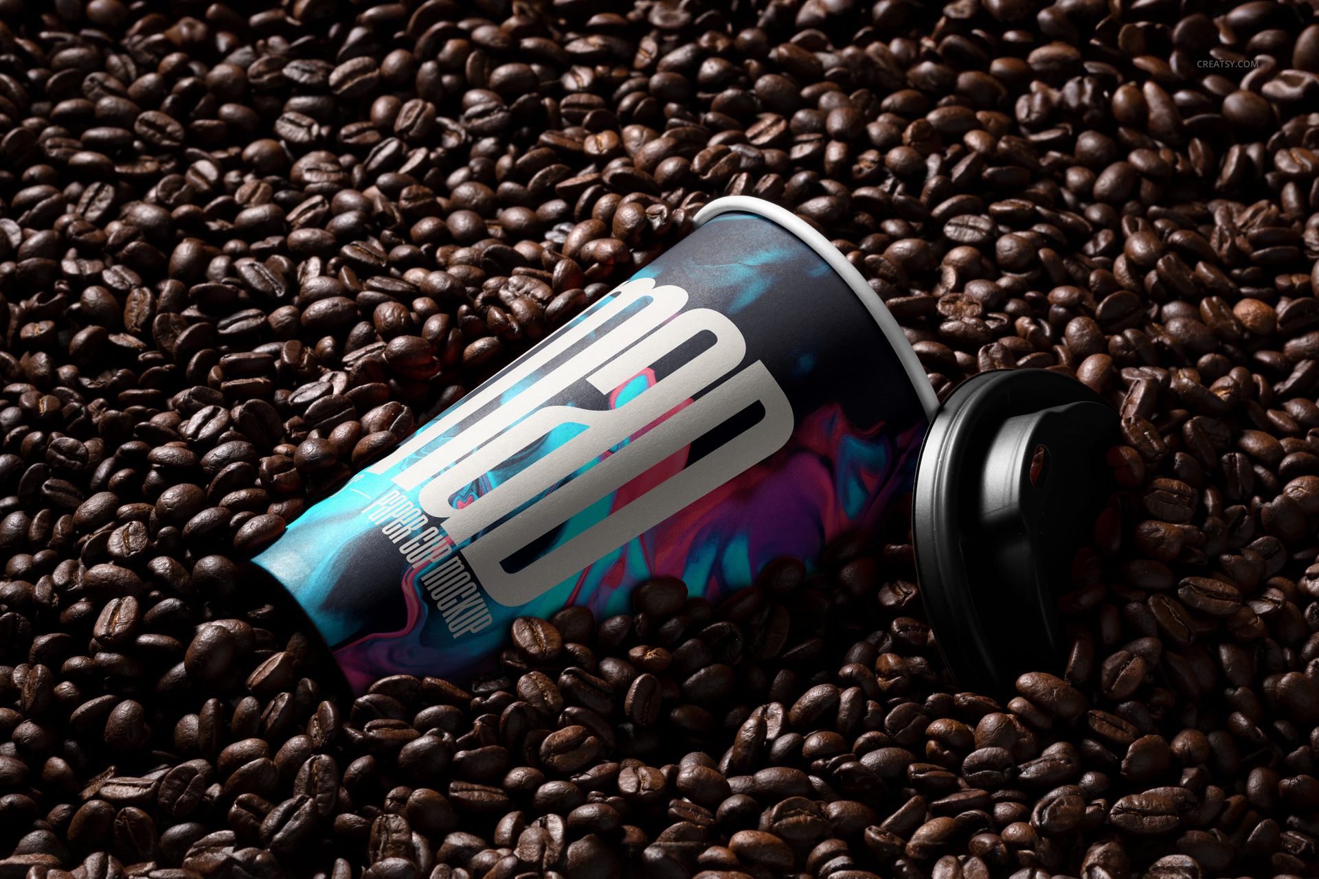 PSD mockup of a paper cup with a vibrant pattern surrounded by coffee beans, showing the cup at an angle.