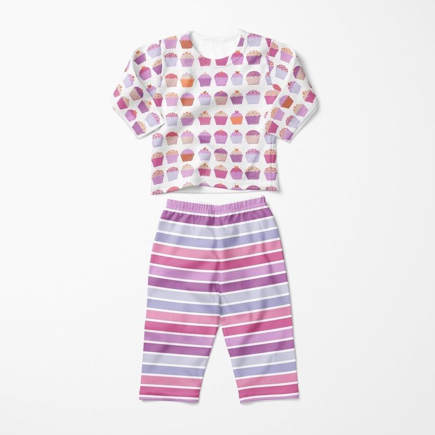 Baby long sleeve pyjama mockup with a cupcake pattern on the top and pink and purple horizontal stripes on the pants, shown on a white background.