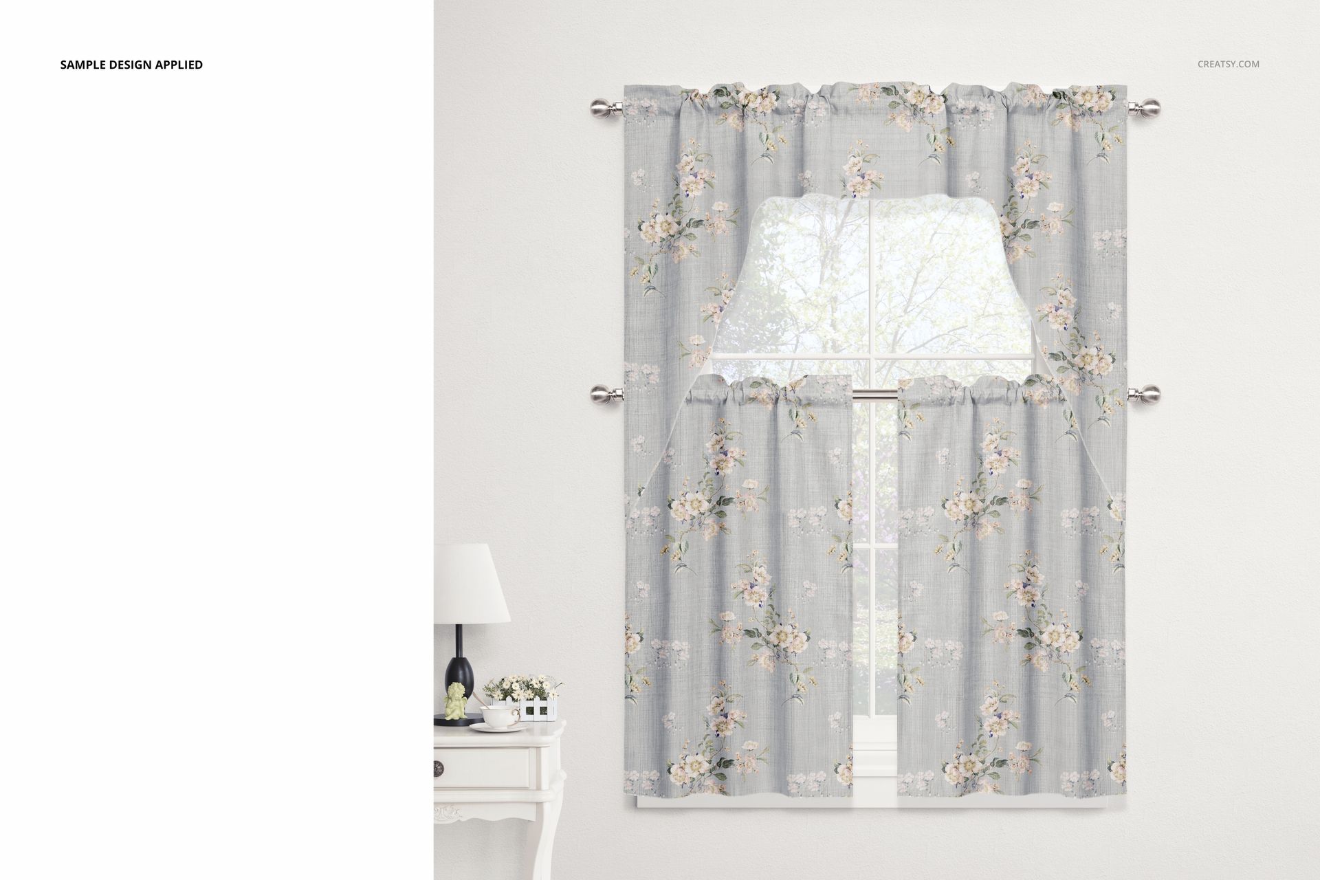 Cafe curtains and valance mockup showing gray fabric with soft floral designs, styled in a bright interior room.