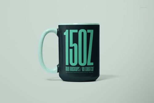 Front view of a 15oz ceramic mug mockup with a dark exterior and large mint green text design on the side.