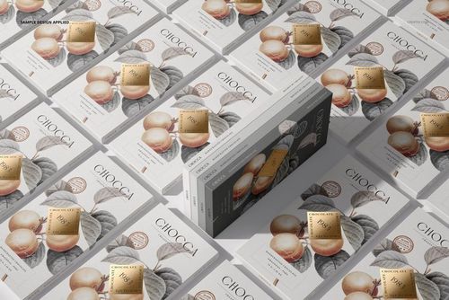 Chocolate bar packaging mockups arranged in a grid, featuring white wrappers with fruit illustrations and gold accents.