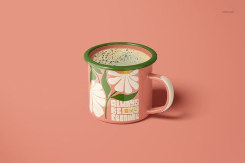Front view of a 360ml enamel mug mockup featuring white flowers and motivational lettering on a pink surface.