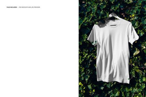 Plain white short-sleeve t-shirt displayed on a hanger with leafy ivy backdrop, PSD mockup, straight-on perspective.