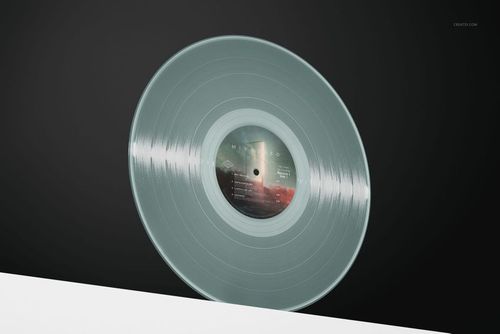 Transparent vinyl record mockup displayed upright with a detailed label, set on a black and white surface.