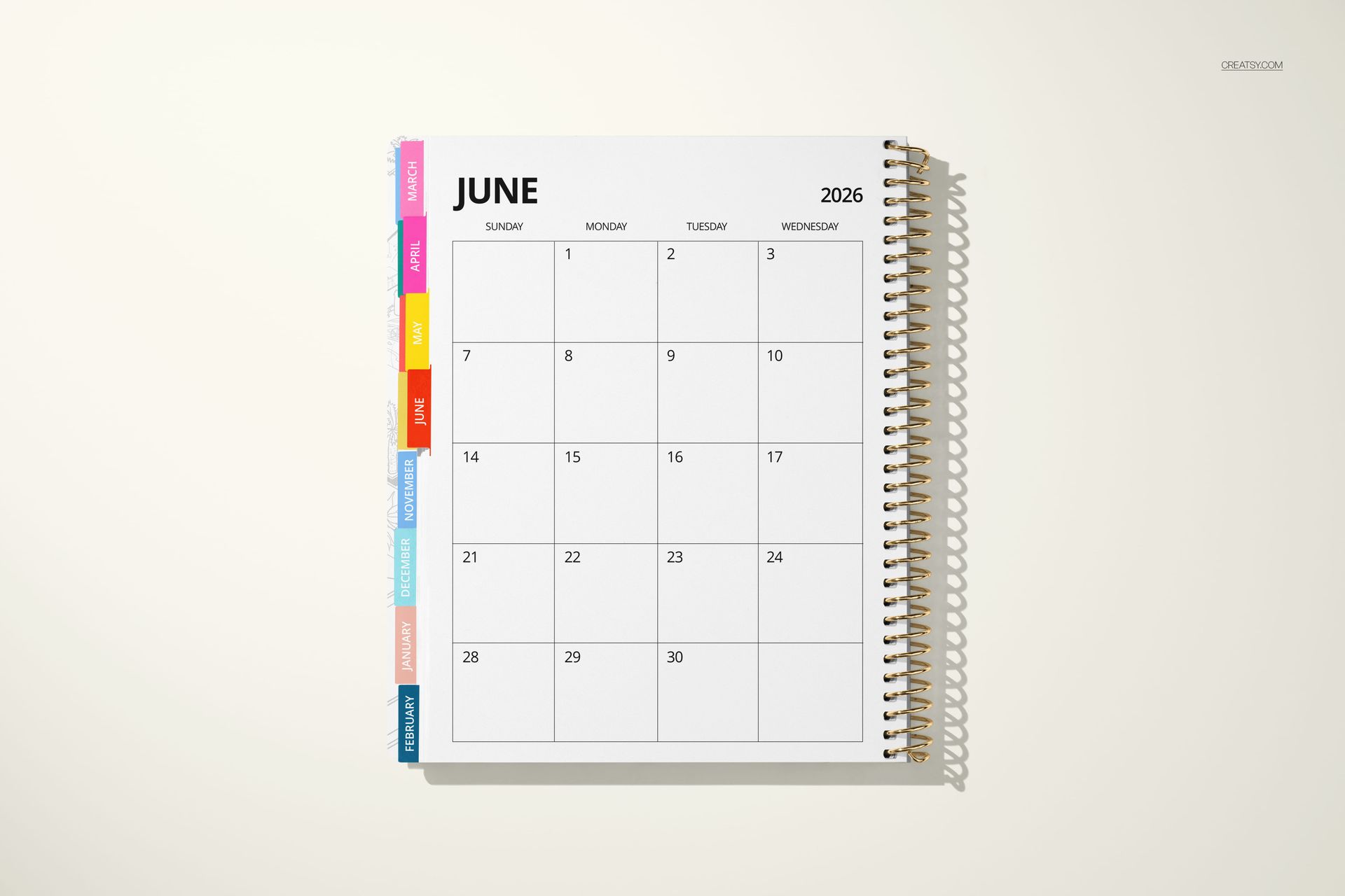Top view of a tabbed weekly and monthly planner mockup showing a clean calendar layout and spiral binding.
