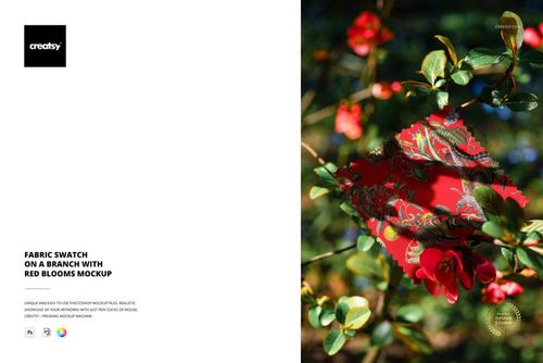 PSD mockup showing a red floral fabric swatch hanging on a branch surrounded by green leaves and blooming red flowers.