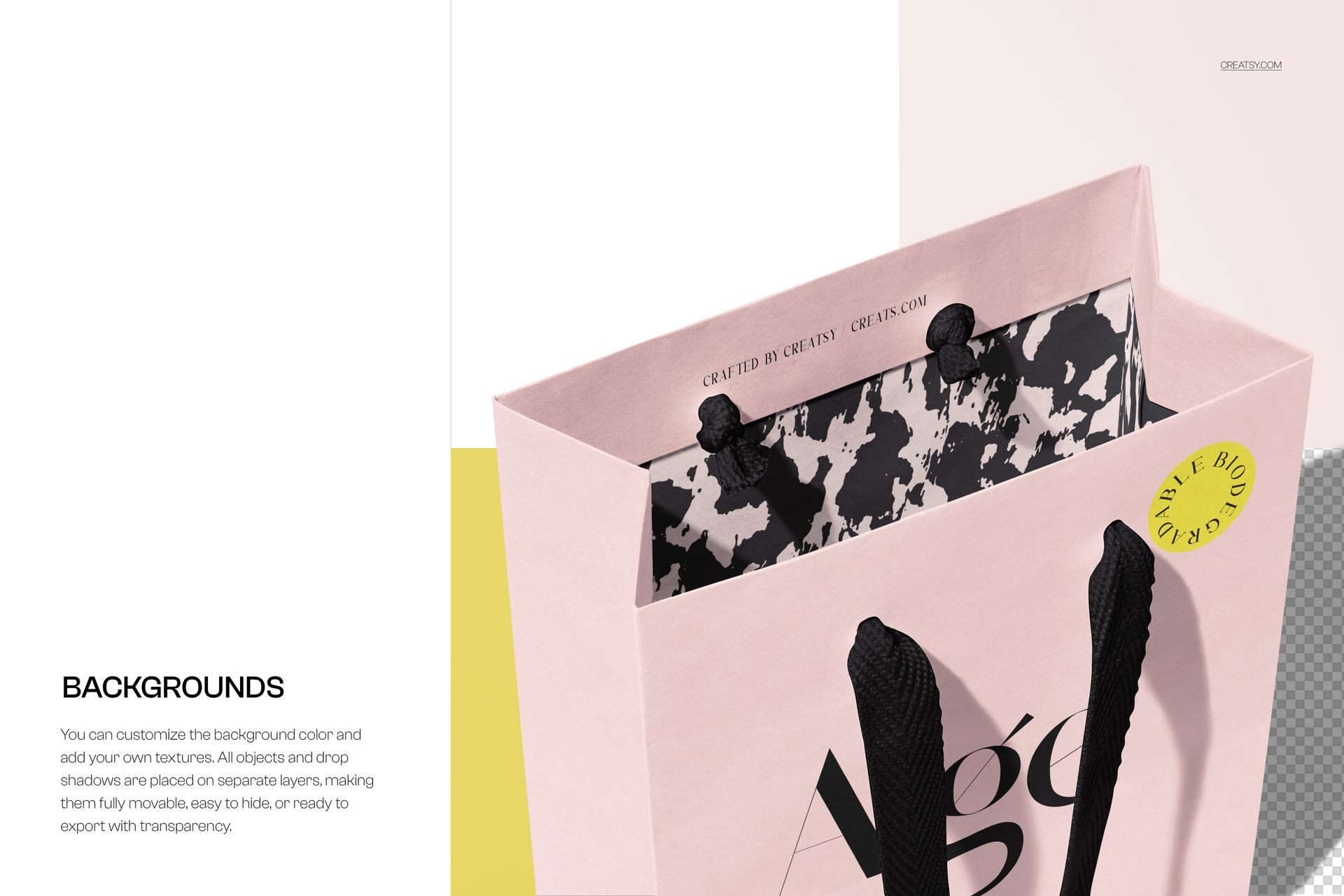 Paper shopping bag mockup in soft pink, featuring black handles and a monochrome abstract interior, viewed from above.