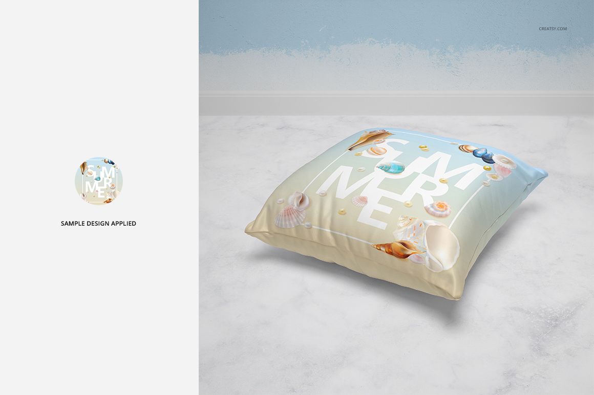 Mockup of a square pillow featuring seashells and text, placed on a marble floor against a blue wall.