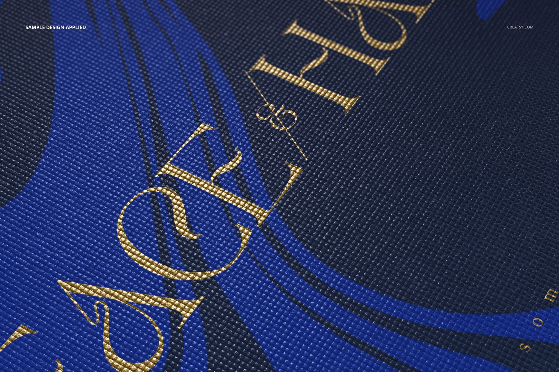 Yoga mat mockup showing a detailed texture, blue background, and gold decorative text in a diagonal layout.