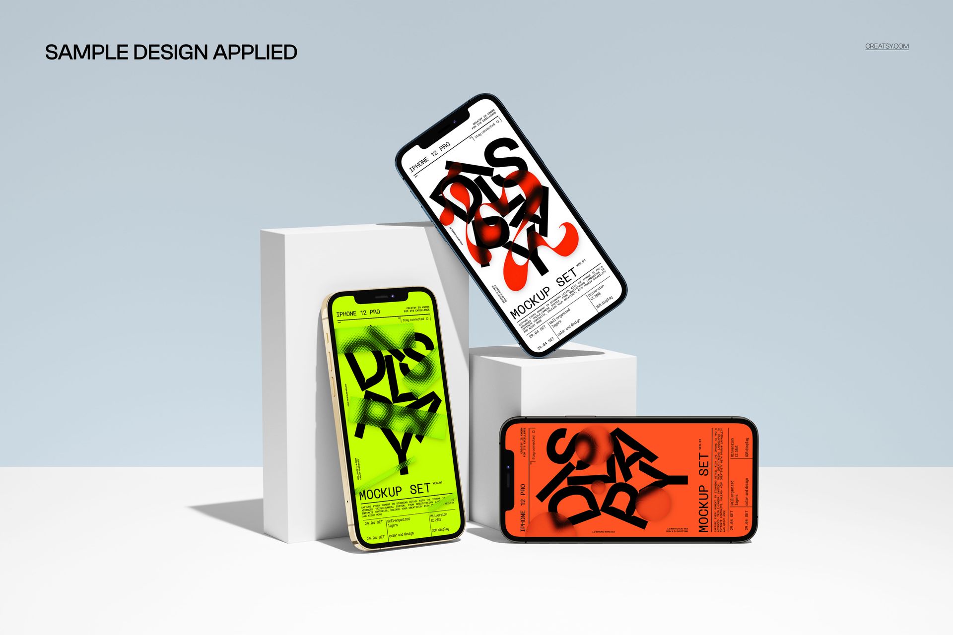 PSD mockup featuring three iPhone 12 Pro models with bold screen graphics, positioned on simple white blocks in a clean scene.