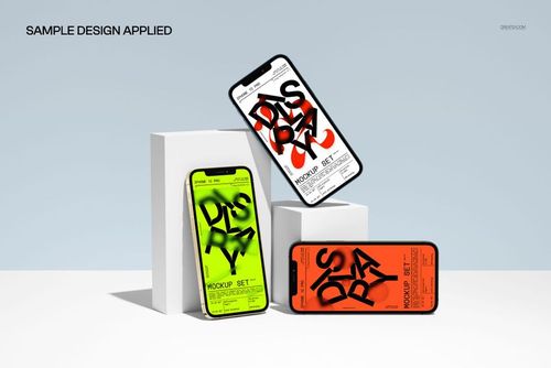 PSD mockup featuring three iPhone 12 Pro models with bold screen graphics, positioned on simple white blocks in a clean scene.