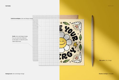 Square folded greeting card mockup featuring a cheerful flower illustration, envelope, and silver pen on a split yellow and white surface.