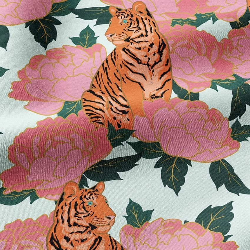 Scuba fabric mockup featuring a repeating pattern of illustrated tigers sitting among large pink peony flowers on a light background.