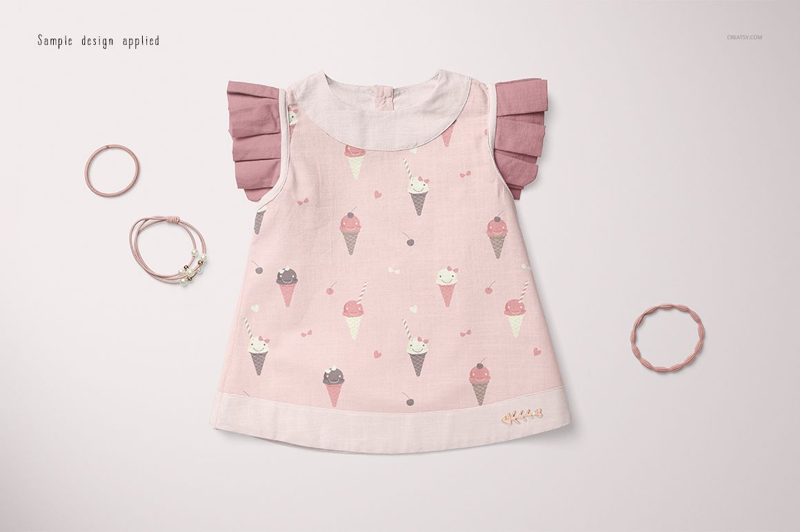 Baby blouse and shorts mockup featuring a light pink outfit with ice cream cone pattern, displayed from above.