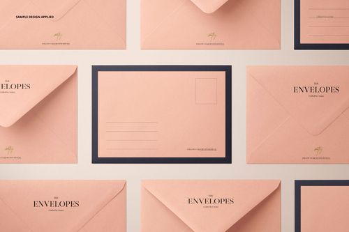 Stationery mockup showing multiple peach C6 envelopes, including one with a black border and address fields.