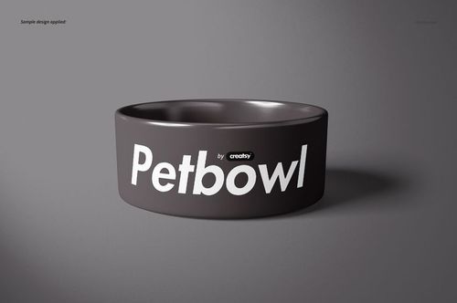 Front view of a round pet bowl mockup with a dark gray exterior and bold white text on a plain gray background.