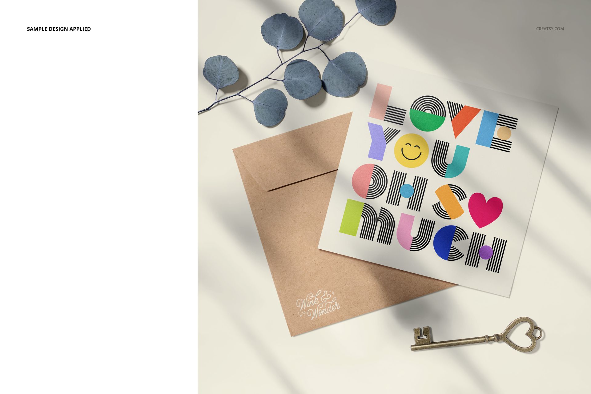 PSD mockup of a square stationery card with vibrant typography, brown envelope, and metal key arranged on a sunlit background.