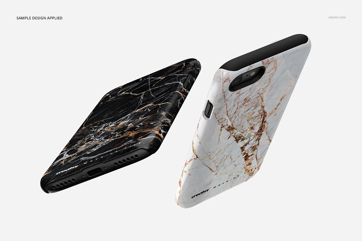 PSD mockup of two iPhone 7 cases, each with a distinct marble pattern, set against a neutral white backdrop.