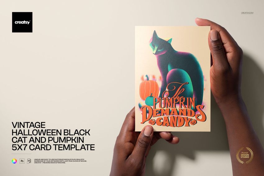 Front view of a Halloween card mockup with a black cat, pumpkins, and retro typography, held by two hands against a beige background.