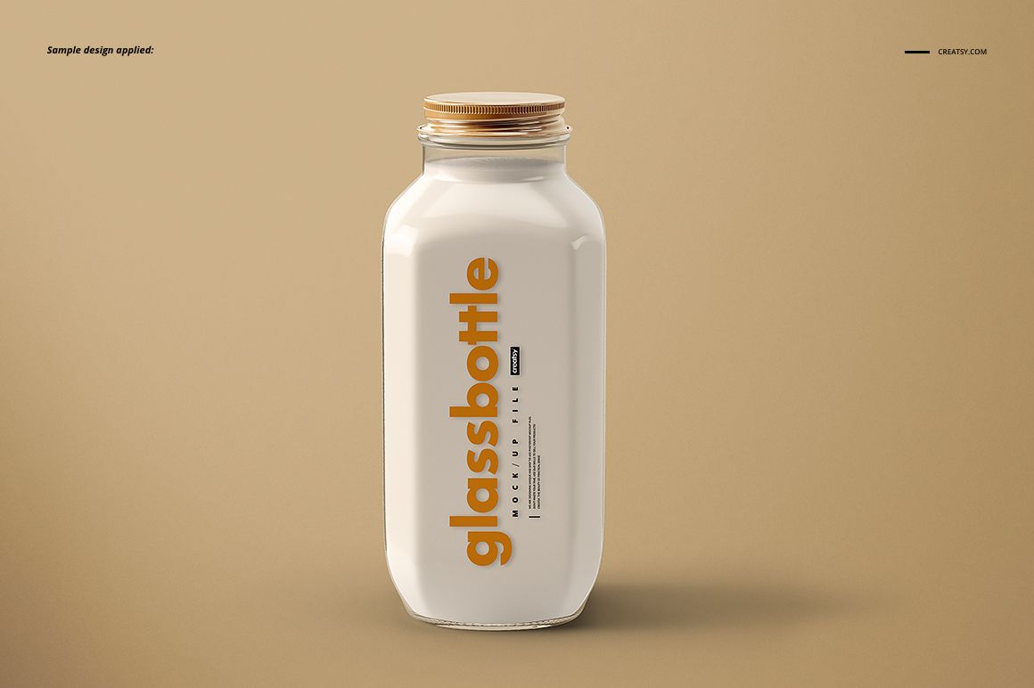 Front view of a glass bottle mockup with a wooden cap, white surface, and bold orange vertical text label.