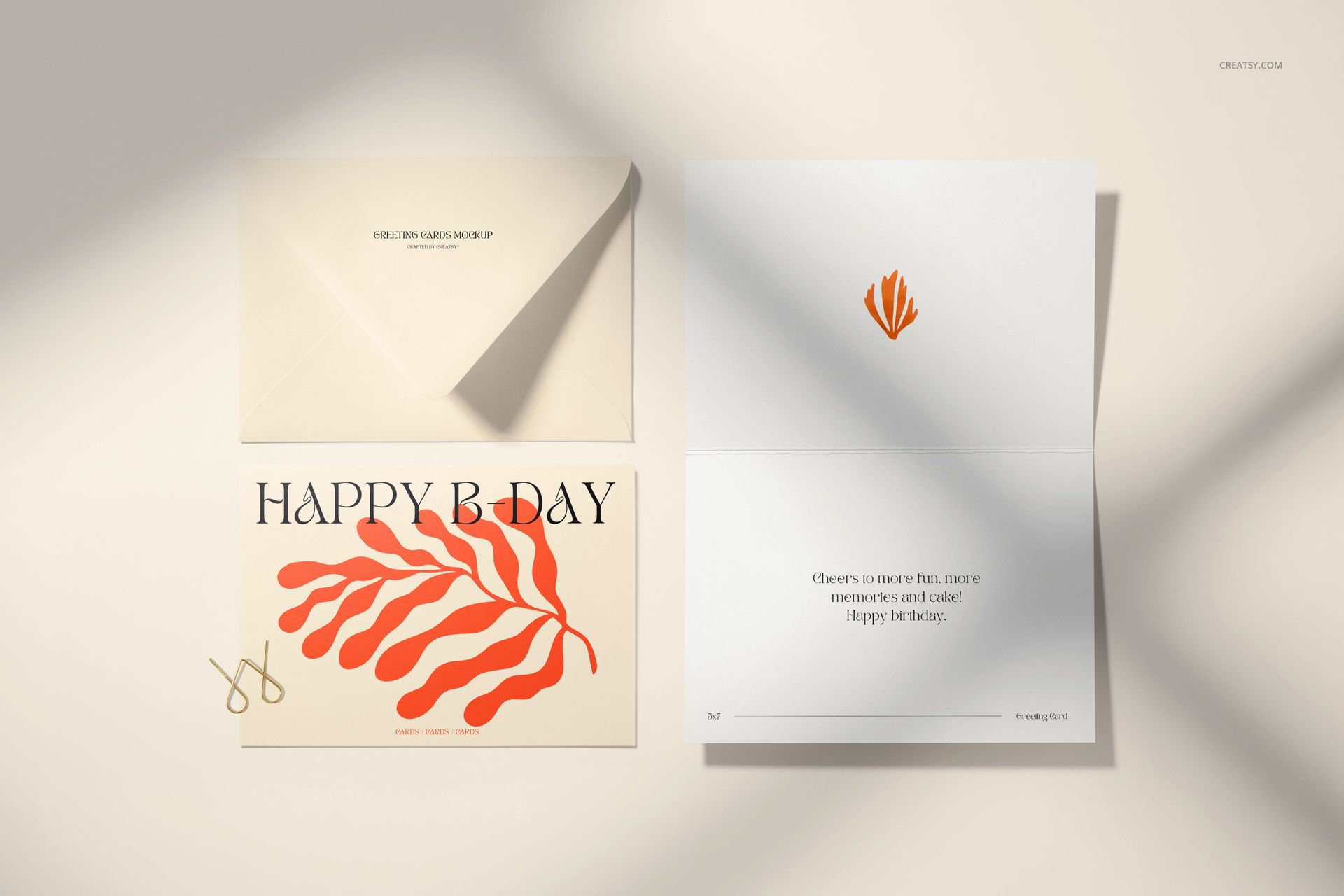 Greeting card mockup set featuring a 5x7 card and envelope on a light surface, with orange leaf design and shadows.