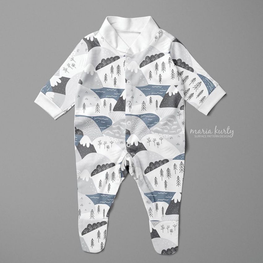 Babygrow sleepsuit mockup featuring a white garment with a winter forest pattern in gray, blue, and black on a gray background.