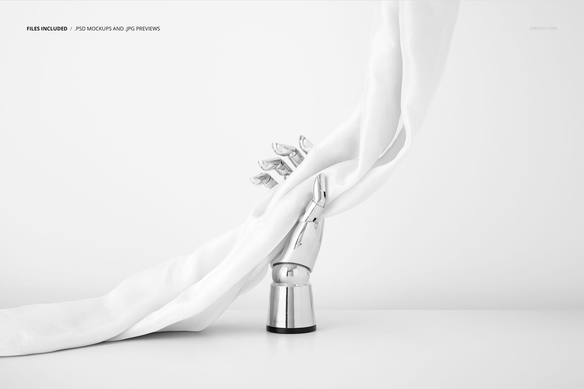Elegant white silk scarf mockup arranged on a silver mannequin hand, minimalist scene with soft fabric folds.