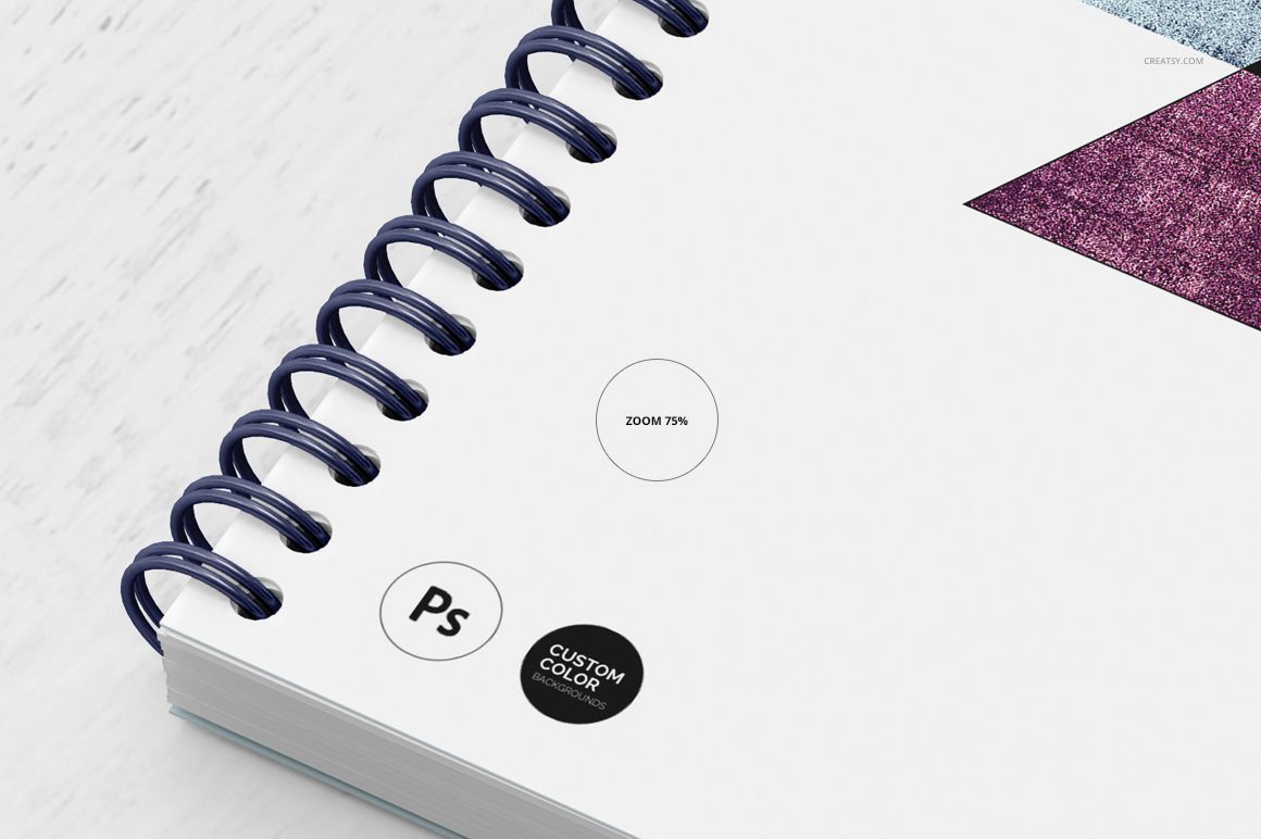 Front view of a spiral-bound notebook mockup with a white cover, blue coil, and geometric color accents.