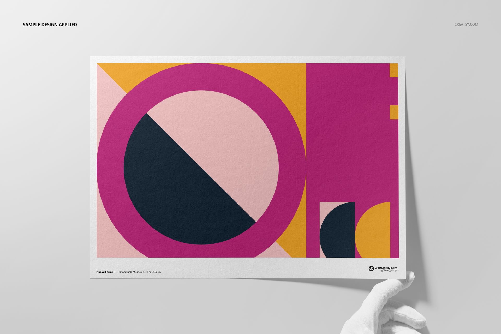 Front view of a Hahnemühle Museum Etching print mockup featuring bold shapes in vibrant pink, yellow, and black.