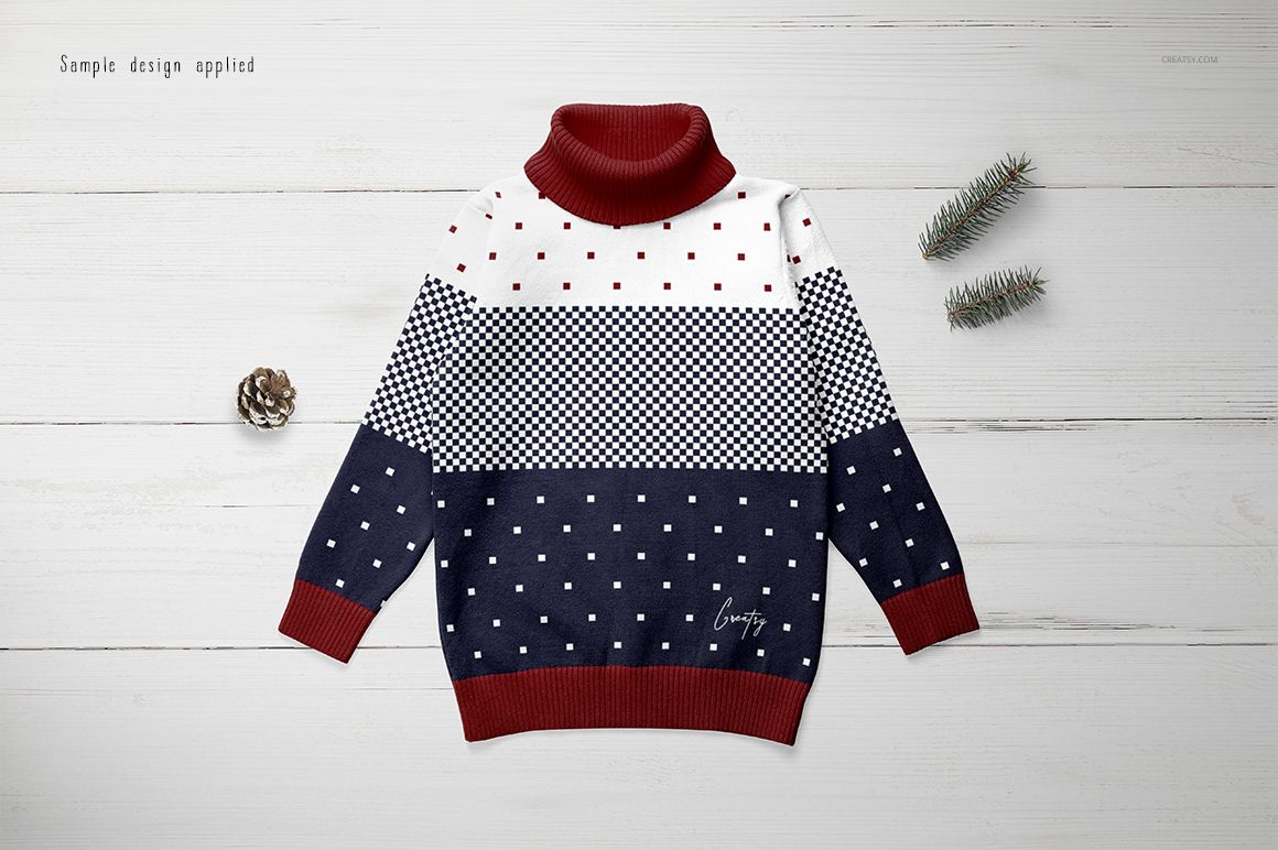 Kids turtleneck sweater mockup with red collar and cuffs, navy and white color blocks, and dotted patterns, top view.