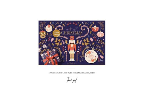 Front view of a paper advent calendar mockup featuring a nutcracker, ornaments, and festive decorations on a dark blue background.