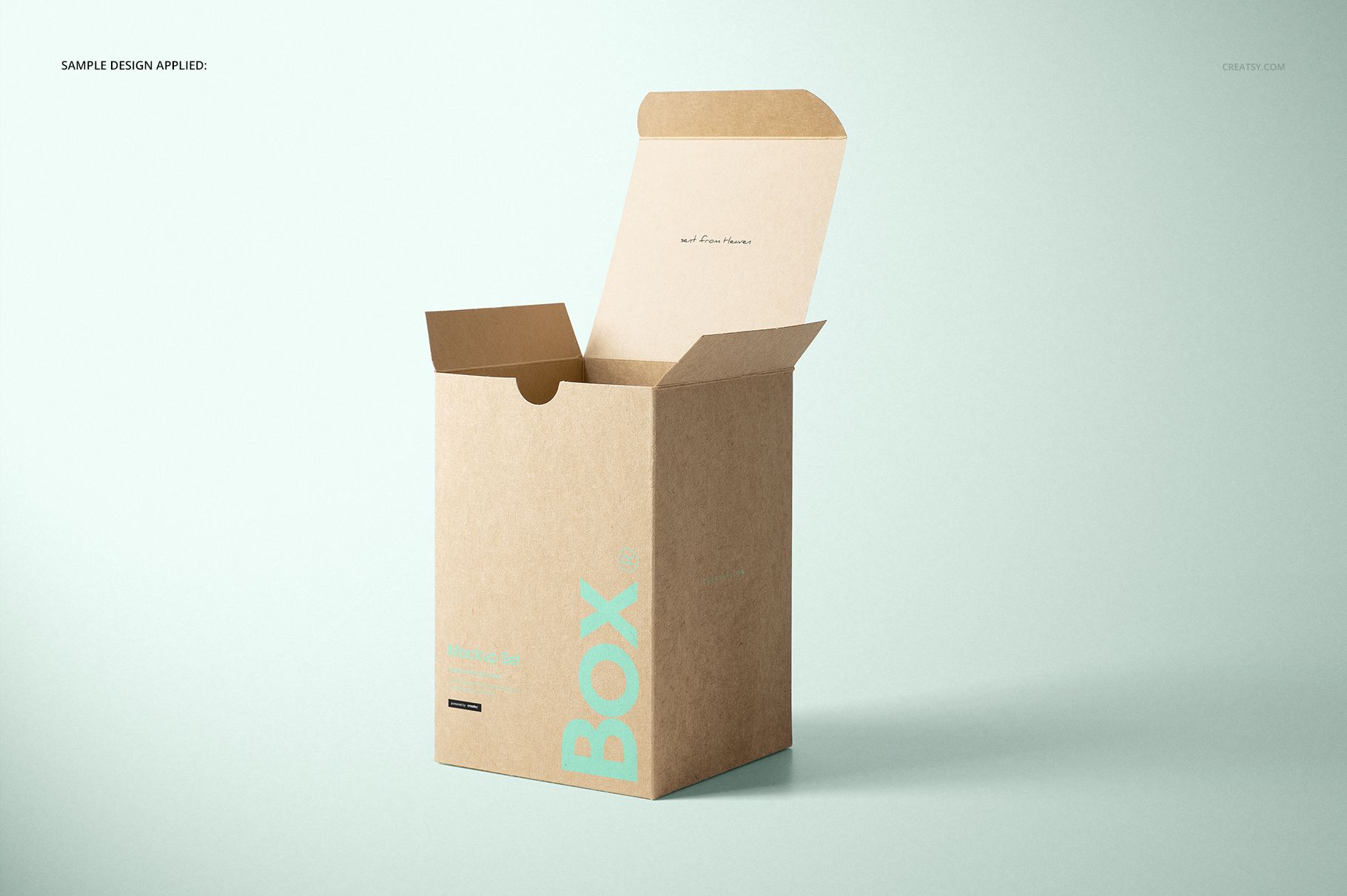 Kraft tuck top gift box mockup shown upright with open flap, light brown surface and minimal blue text design.