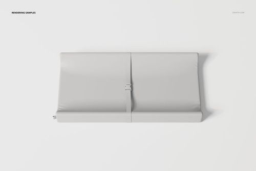 Contoured changing pad in light gray color, viewed from above, featuring a central safety strap on a white background.