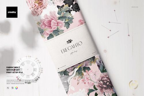 Top view of a fabric bolt mockup featuring pink and gray flowers, surrounded by pins on a light background.