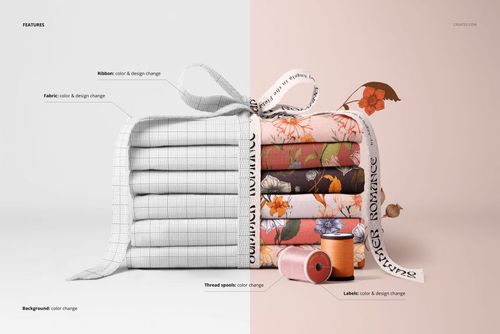 PSD mockup of neatly stacked fabrics tied with a ribbon, with spools and labels placed beside the colorful textiles.